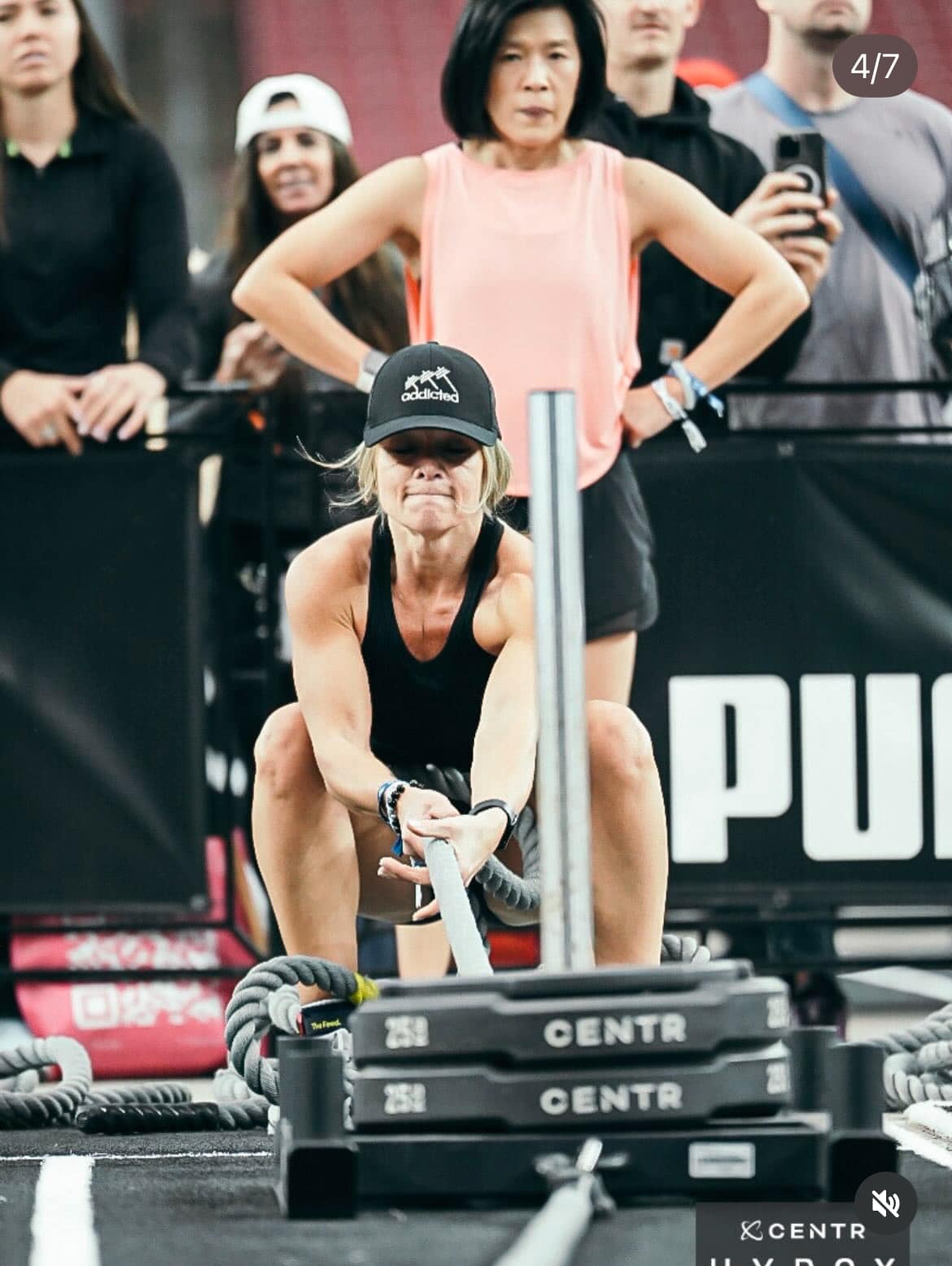 Infinity Fitness AZ coach competing in a HYROX sled pull event